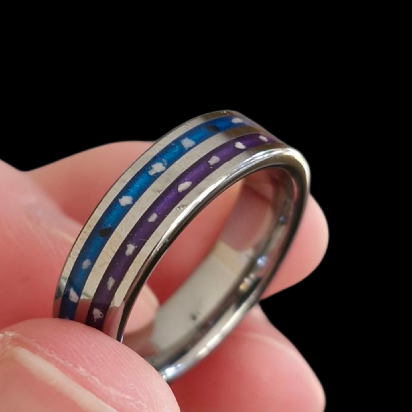 Ring with blue and purple inlay containing cremation ashes