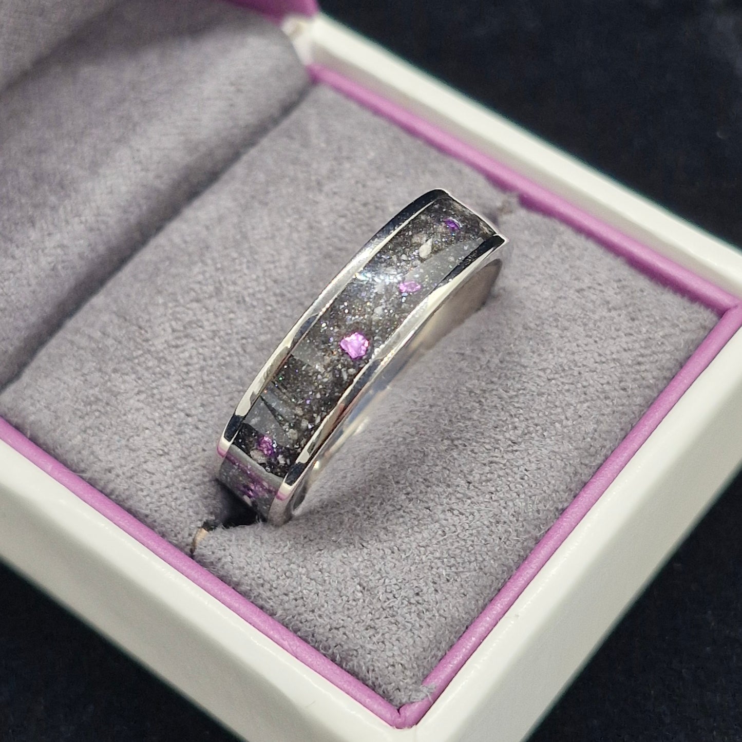 6mm wide channel ring containing cremation ashes and purple stone