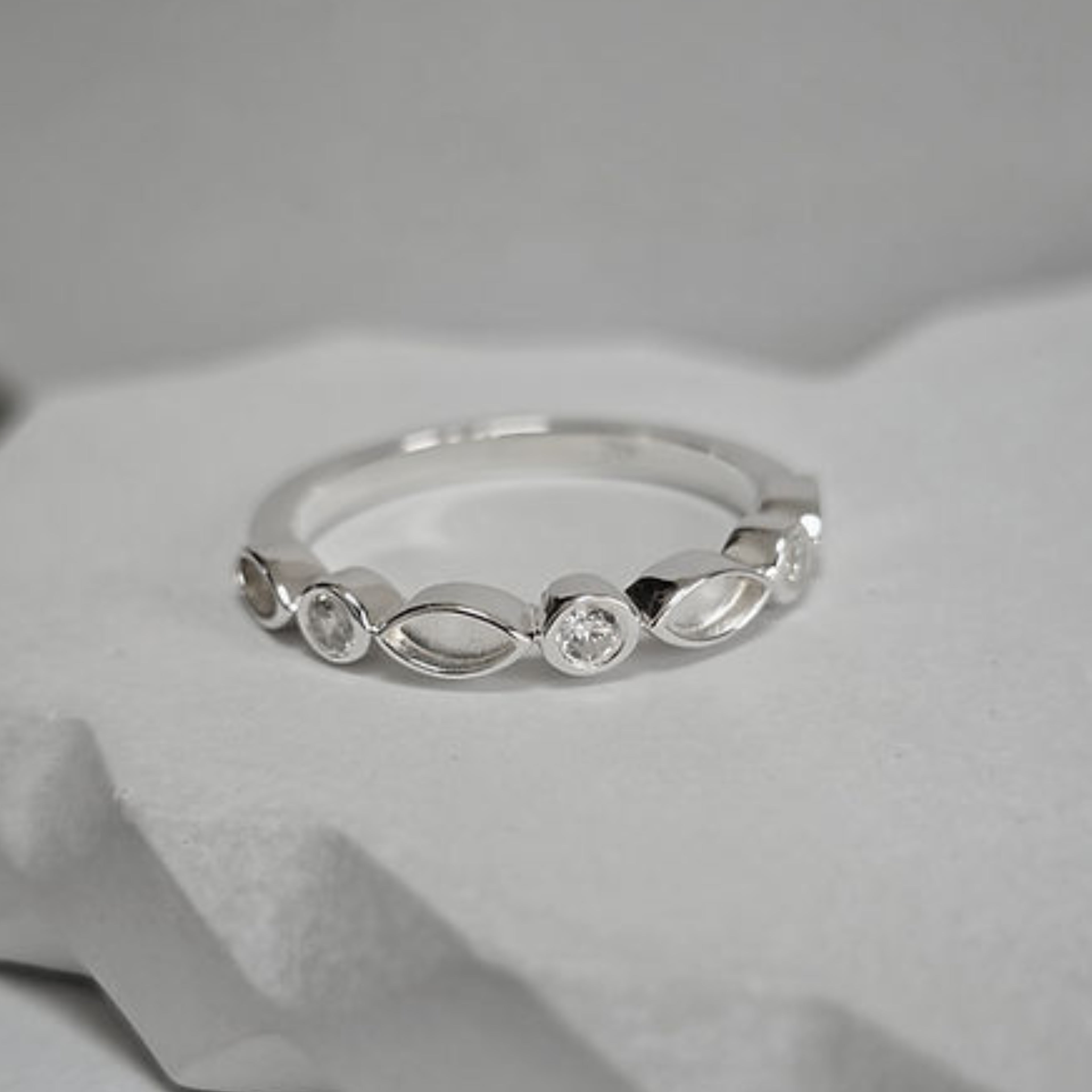 Bezel set half eternity style ring