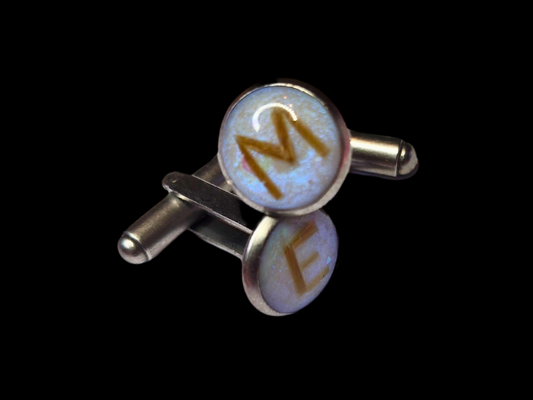 Cufflinks containing preserved breastmilk and baby hair