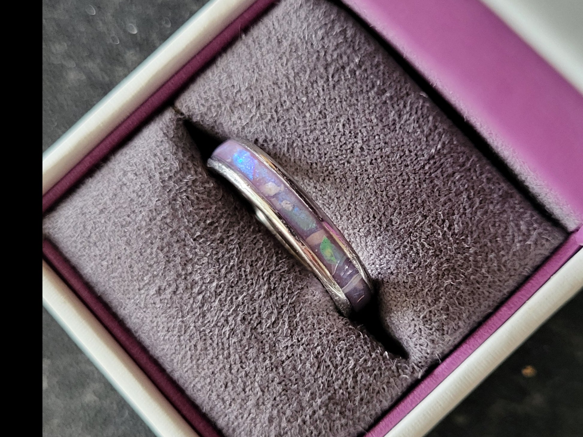 4mm channel ring containing cremation ashes, aubergine dream mica and mylar