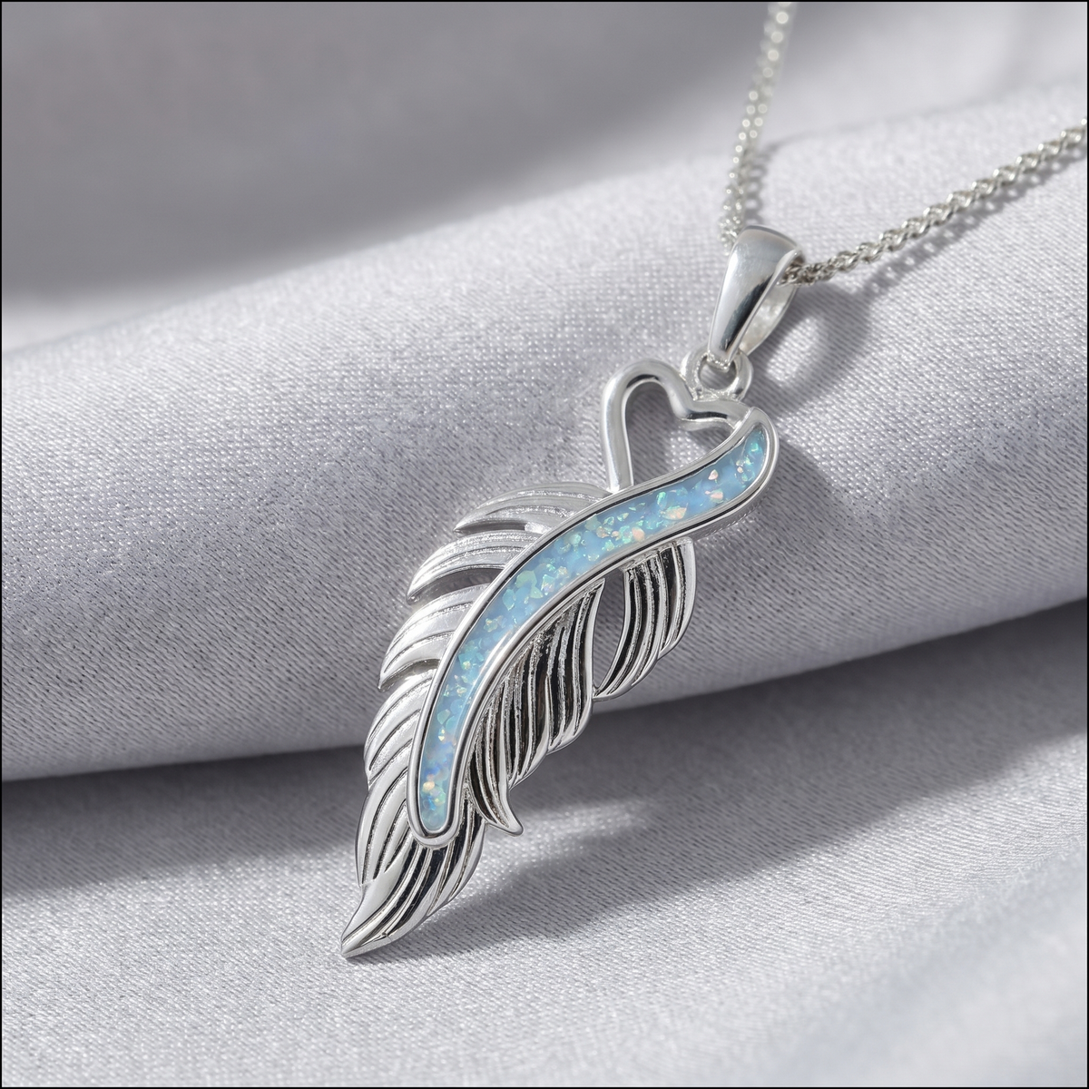 Sterling silver feather pendant with cremation ashes