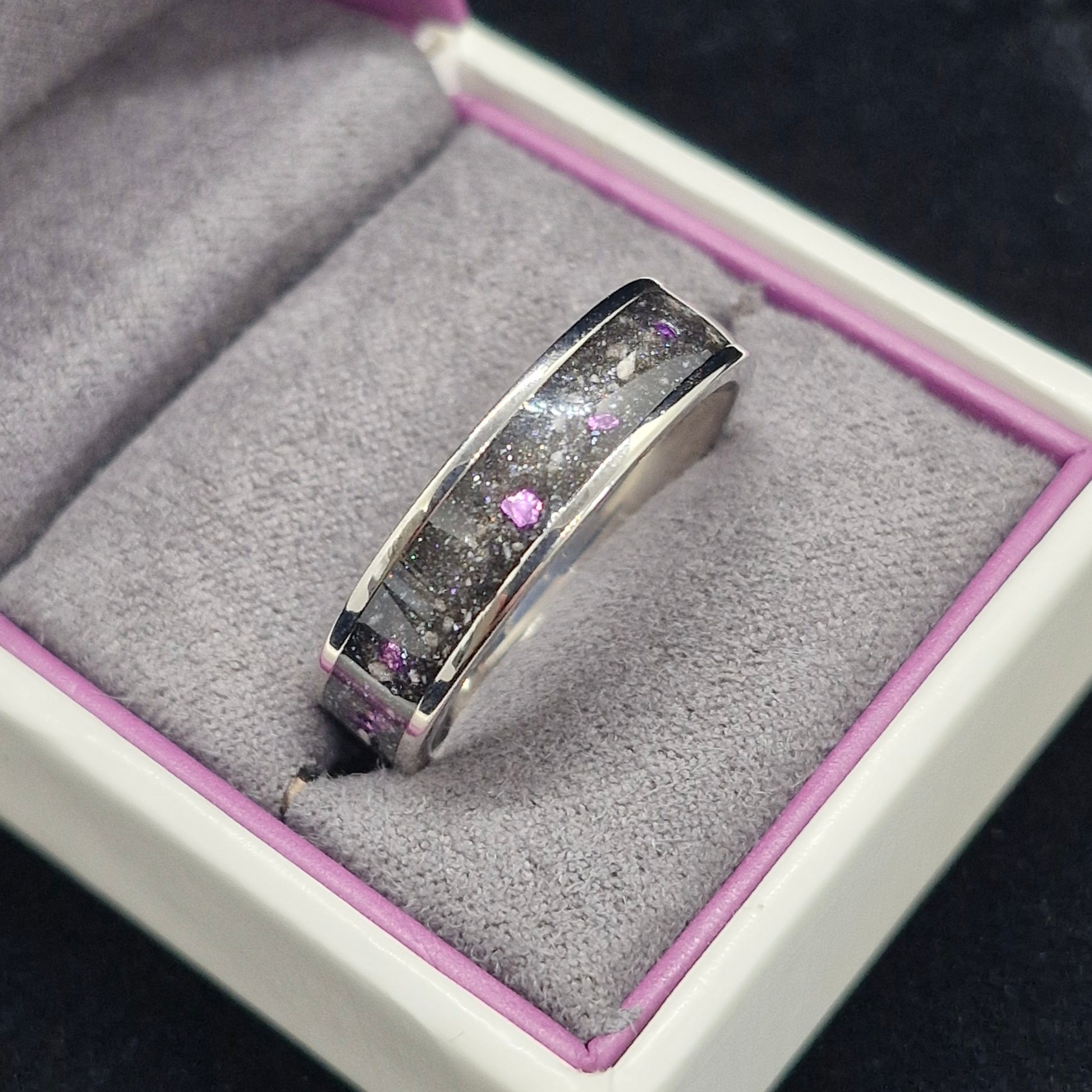 6mm wide channel ring containing cremation ashes and purple stone