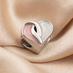 Crossover heart charm
