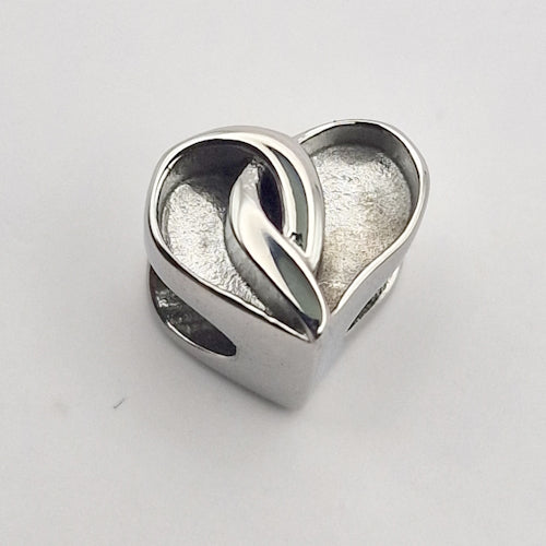 Crossover heart charm